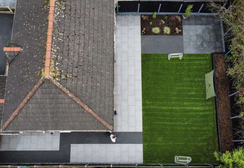 Aerial view of a porcelain patio and artificial lawn
