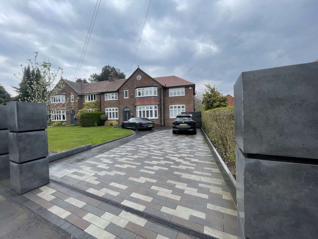 New block paving driveway with rendered entrance pillars