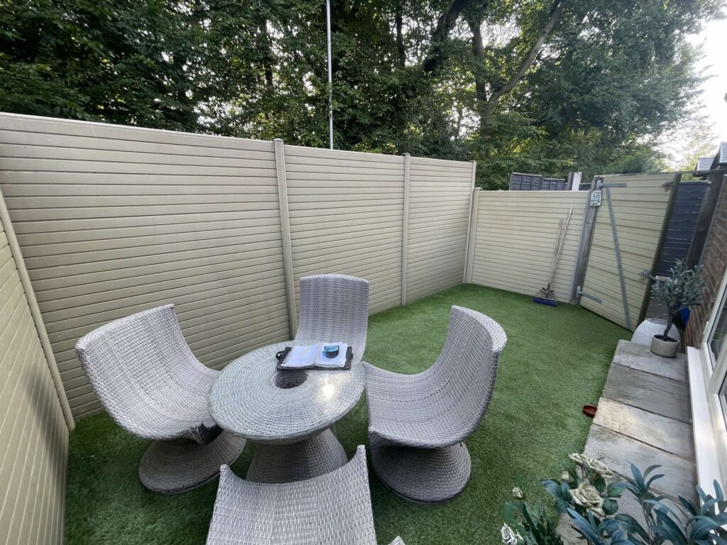 Composite fencing around an artificial grass seating area