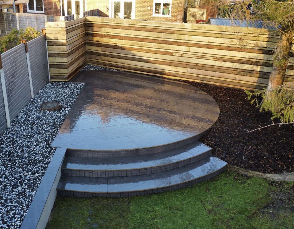 Curved dark porcelain platform with steps