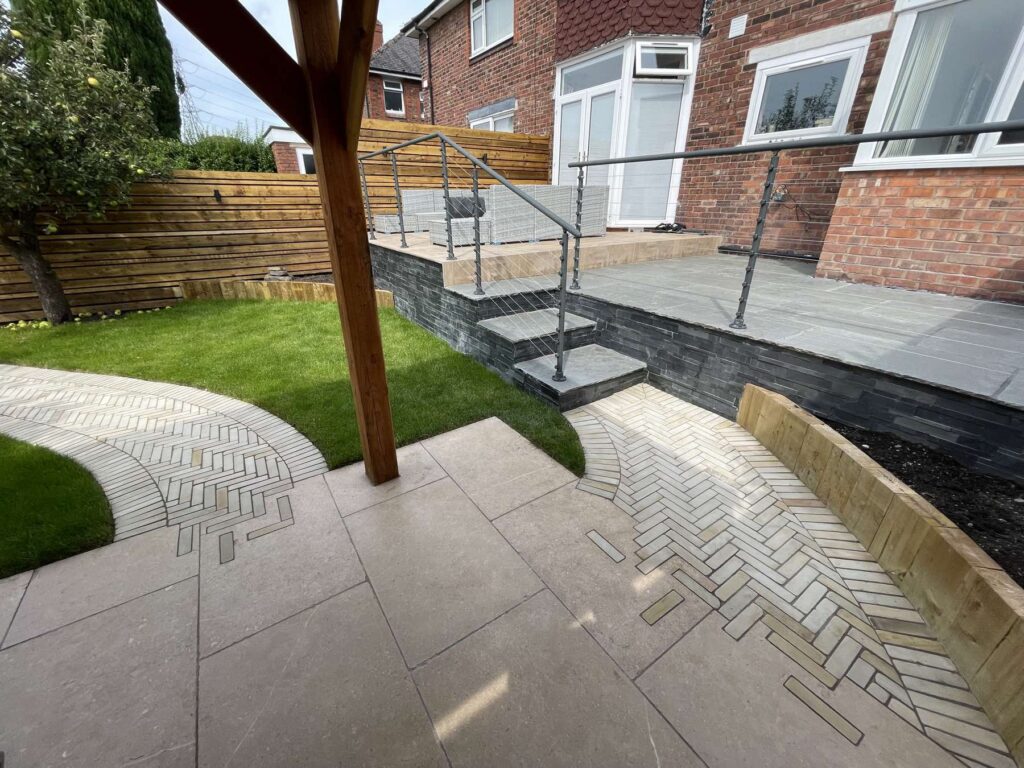Garden steps with porcelain and herringbone paving
