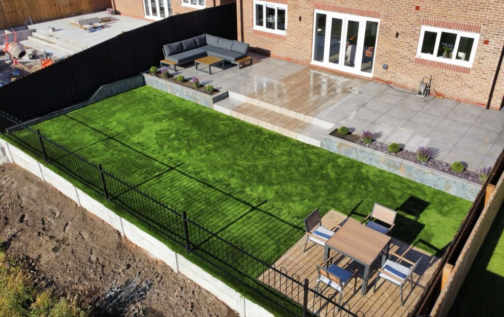 Finished new-build garden with a porcelain terrace and lawn