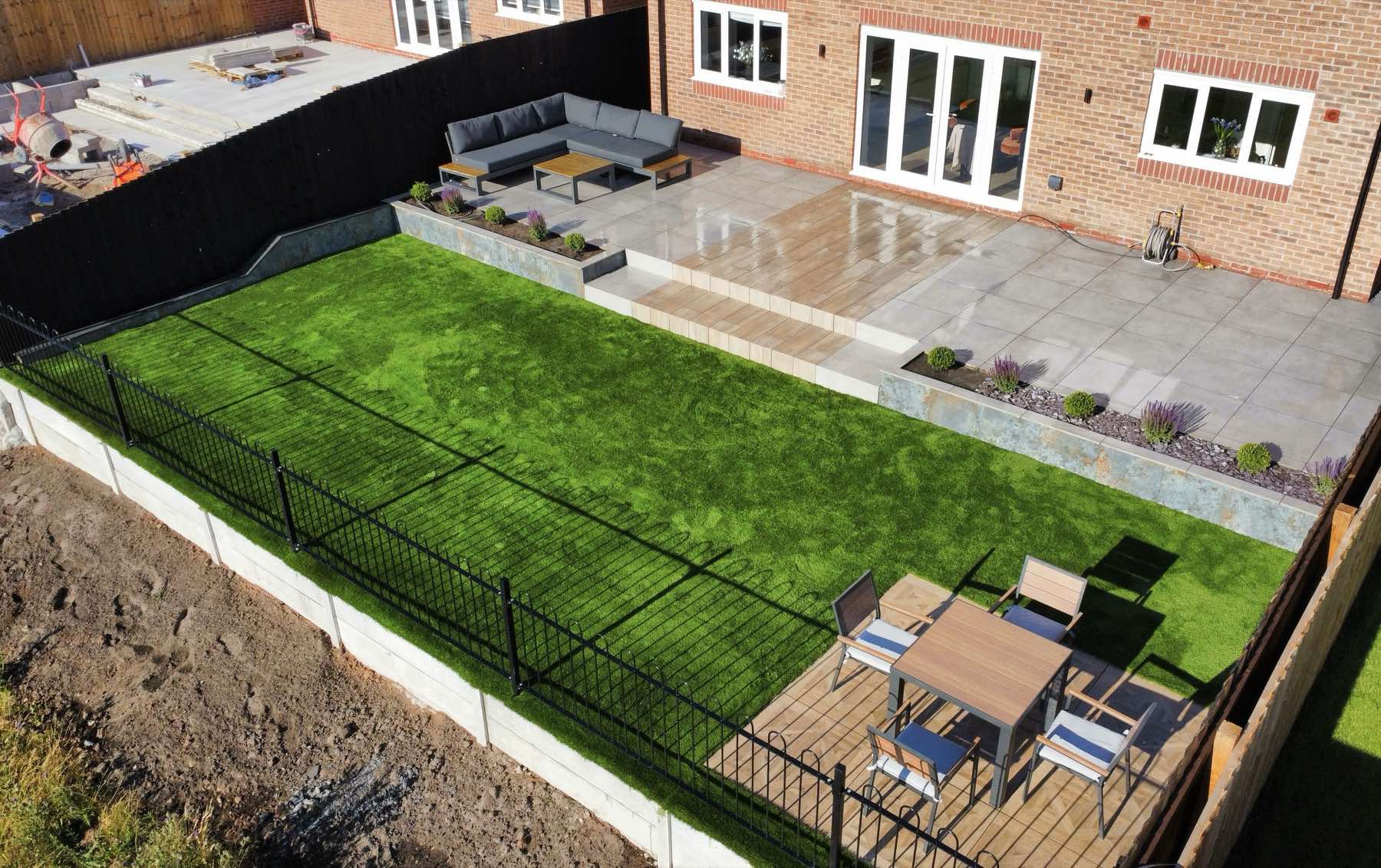 Finished new-build garden with a porcelain terrace and lawn