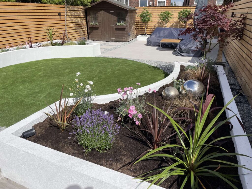 Raised white planter with lavender and mixed planting