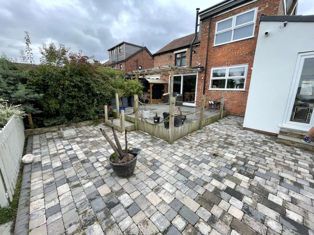 Tumbled setts patio behind a house